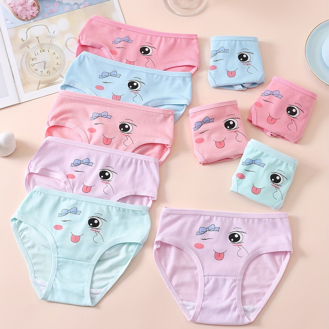 10 pieces of girls' soft and comfortable cotton briefs with cute patterns and breathable fabric.