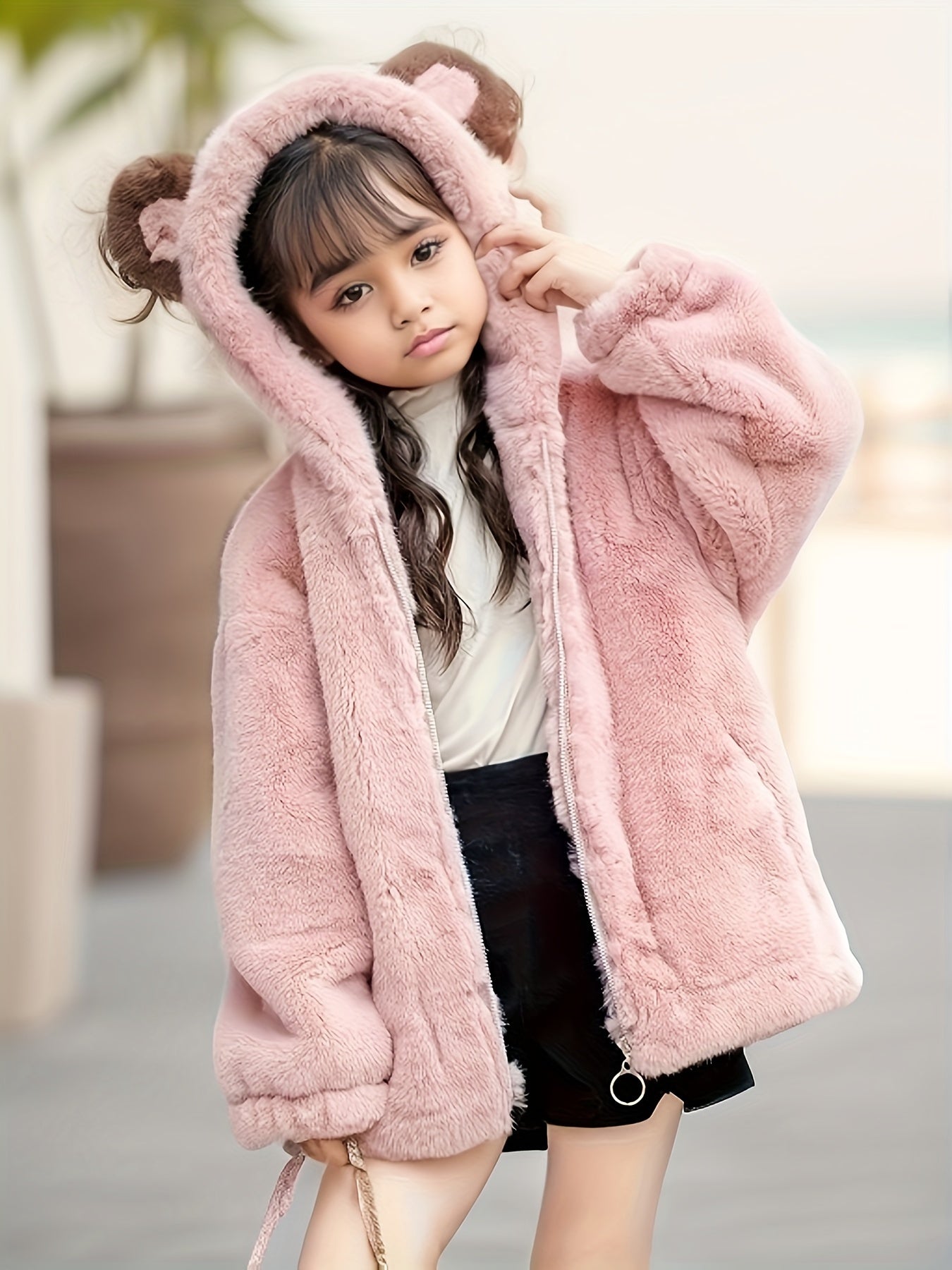 Kid's faux mink fur coat with bear ears hood for warmth in cold weather.