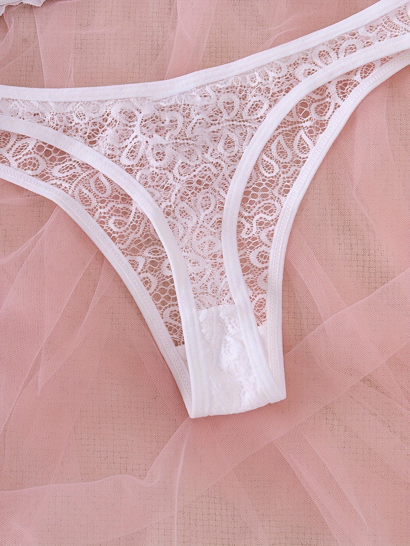 Lace bra and panty set with mesh details, revealing yet comfortable design.