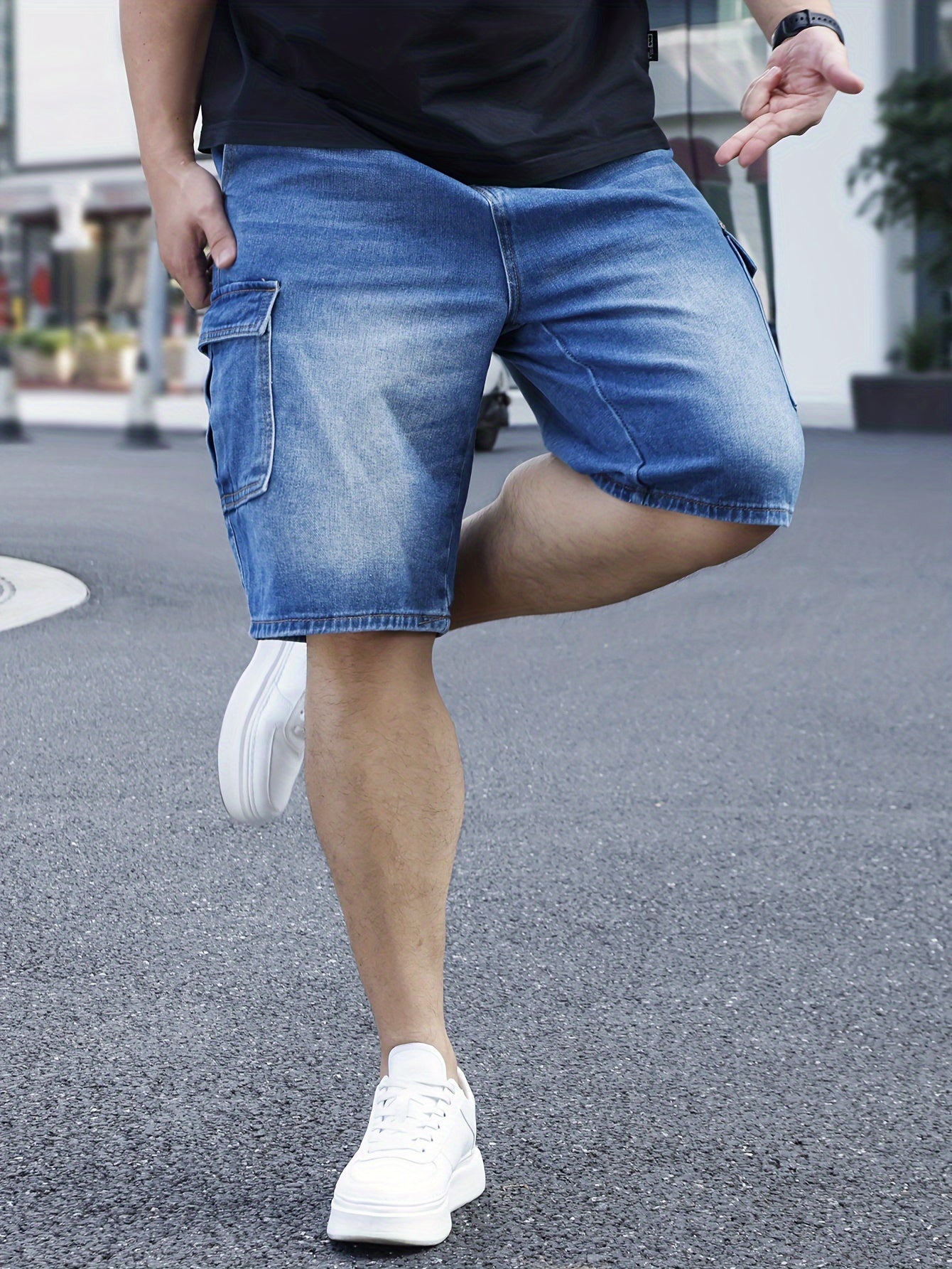 Men's plus size light blue denim shorts with casual fit, pockets, and classic style for casual attire.