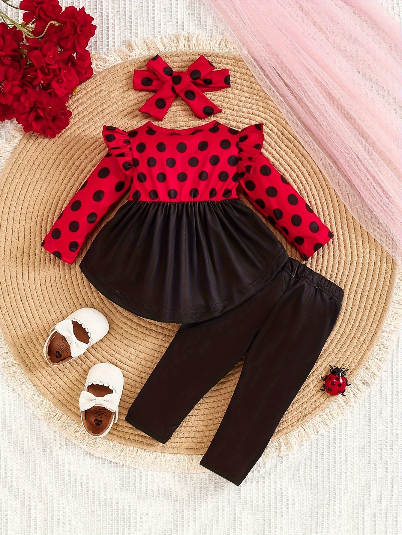 Ladybug print polyester toddler outfit with long sleeve crew neck pullover, matching pants, and headband. Made from slight stretch knit fabric for fall/winter. Regular fit raglan sleeve