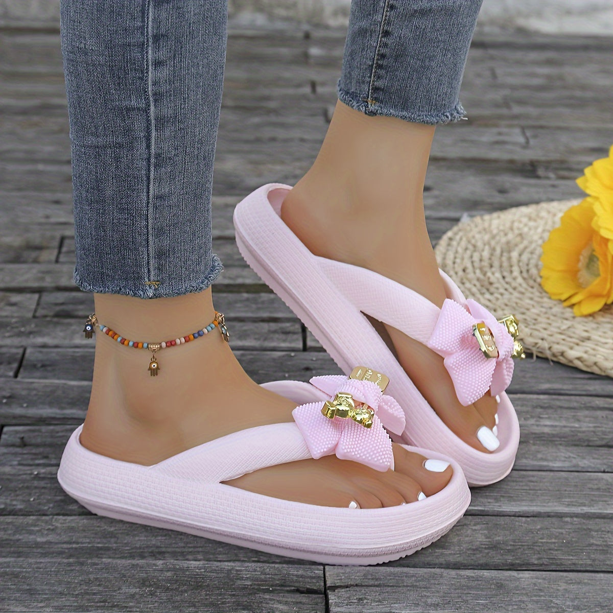 Women's fashionable EVA flip-flops with metallic bow accent, soft and comfortable in pastel colors, easy to clean, perfect for casual and beach wear.