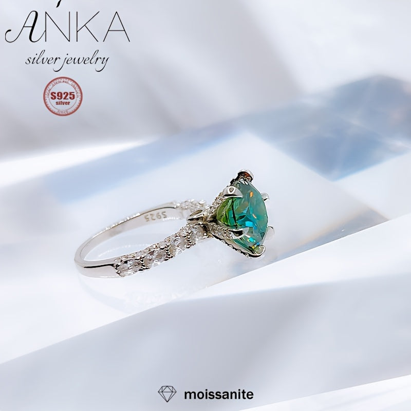 Classy S925 Sterling Silver Ring featuring a stunning 3ct Green Moissanite stone, perfect for engagements or as a luxurious gift. The band is embellished with non-plated Moissanite stones, making it suitable for all seasons. Available in sizes 3.3-3.5g.