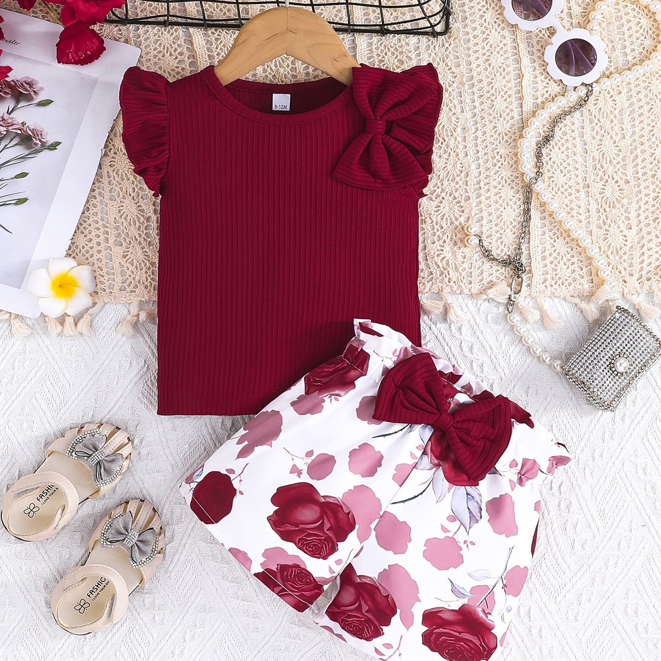 Cute girls' summer outfit: Maroon ribbed T-shirt with bow and floral print shorts set - Made with easy-care polyester blend, machine washable, ideal for outdoor wear.