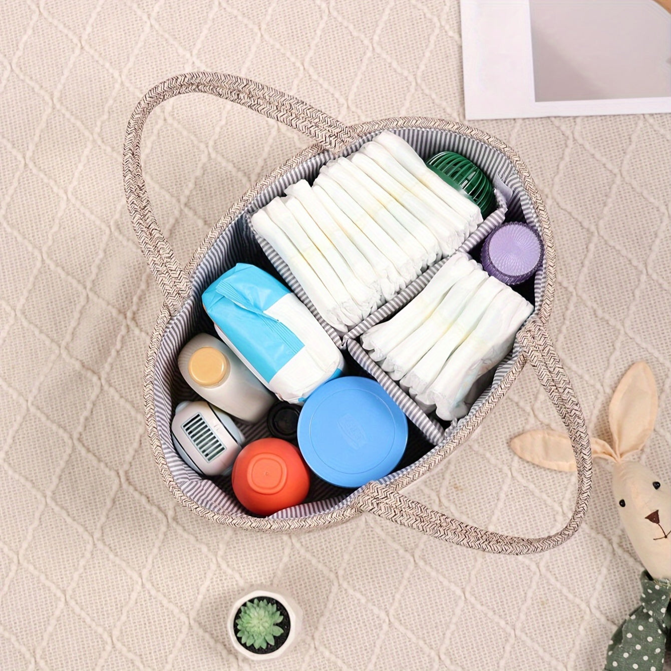 Storage basket made of cotton rope with lettered design, featuring a detachable inner basket for separating dry and wet items. Can be used as a hand-held storage solution.