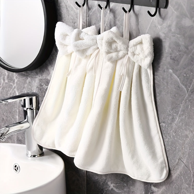 3-piece kitchen towel set with bowknot skirt pattern. Absorbent and quick-drying for household cleaning. Ideal kitchen essentials.