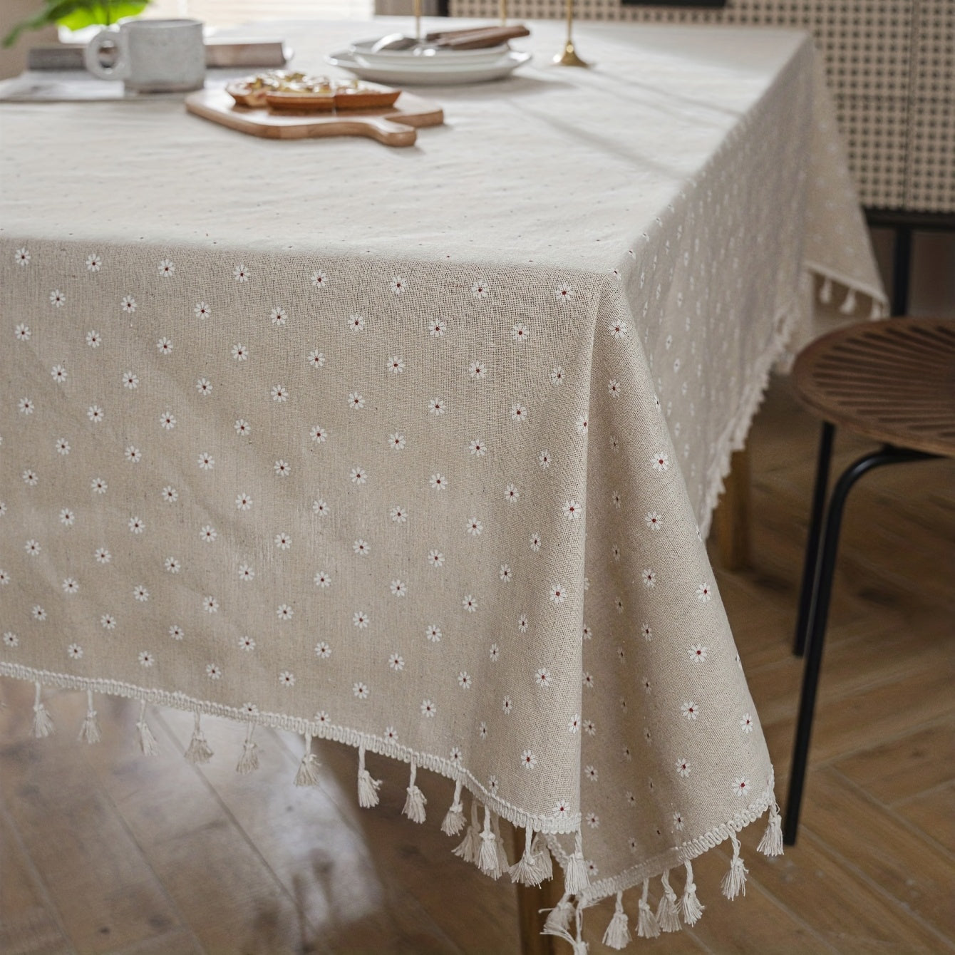 White chrysanthemum and beige linen print farmhouse floral tablecloth with tassels, ideal for kitchen and dining decor. Ready for Thanksgiving, made of polyester, rectangular shape.