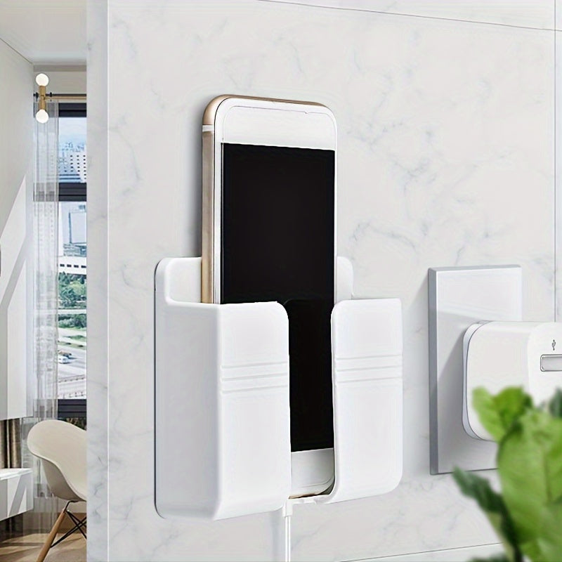 Wall-mounted mobile phone charging stand with storage shelf for organization in bedroom or office.