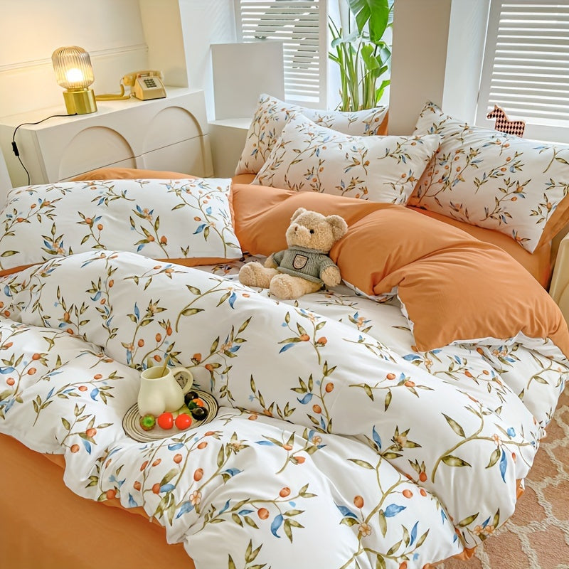 Orange flower and fruit plant pattern quilt cover set includes 1 quilt cover and 2 pillowcases in a pastoral style. Made from comfortable and skin-friendly material, it is non-ball and can be machine washed. Available in single, double, standard, and