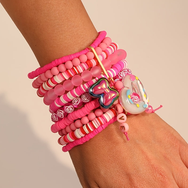 Bohemian-inspired Multi-Layer Pink Resin Beaded Bracelet featuring Heart & Butterfly Charms, a Lovely Pendant Jewelry Piece for Women. Ideal for Valentine's Day, Everyday Wear, or Vacation Style. A Versatile Fashion Accessory for All Seasons.