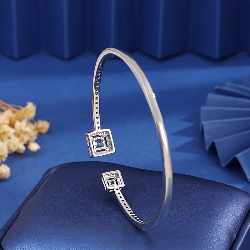 This elegant Boho style cuff bracelet is crafted in 925 silver with a square Moissanite gemstone. It is a fashionable and sparkling piece of jewelry perfect for women to wear daily or as a gift. Suitable for all seasons, it is ideal for the Spring