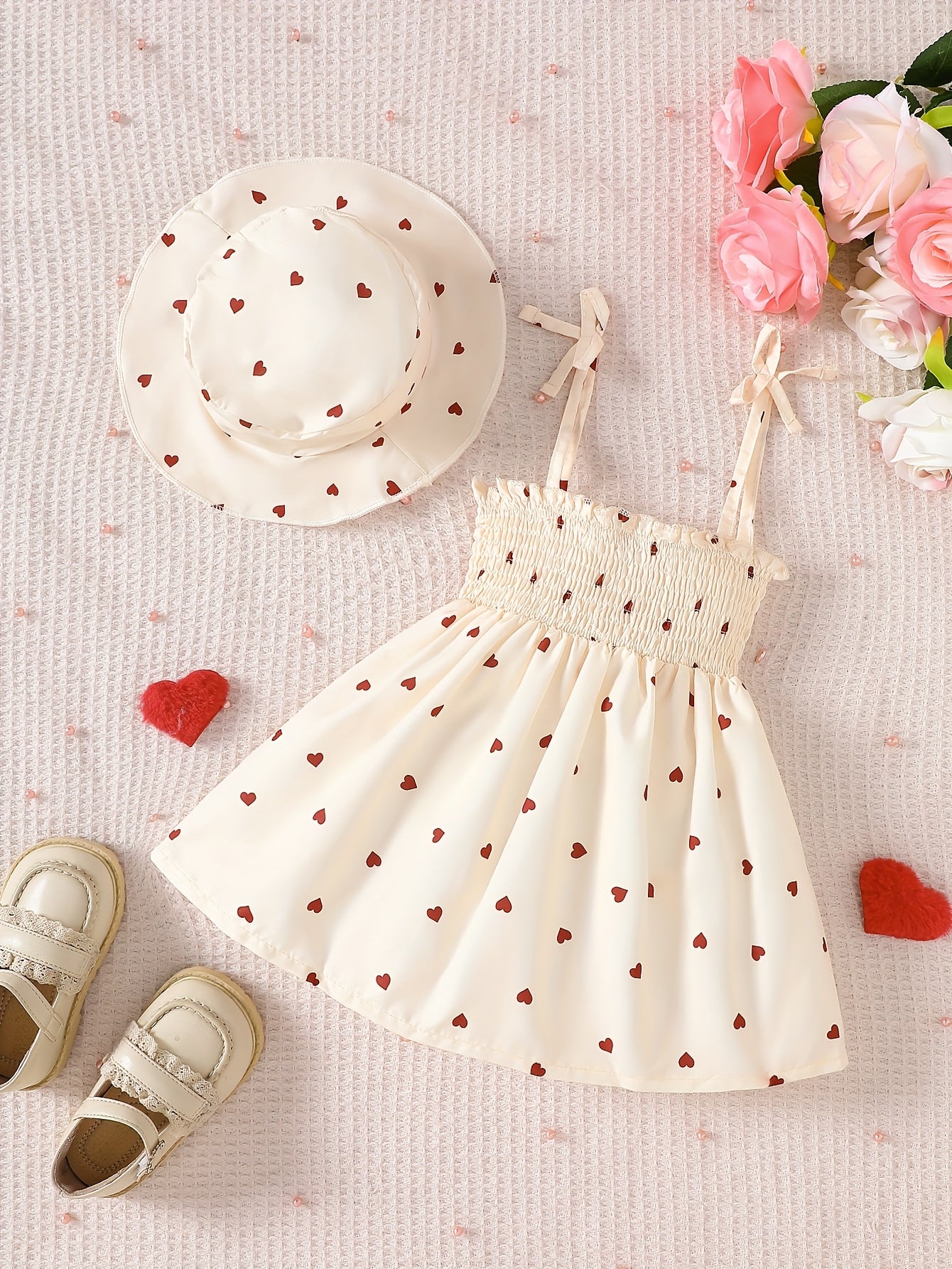 Girls' sleeveless umbrella skirt dress with peach heart print, drawstring suspender, perfect for summer outdoor wear.