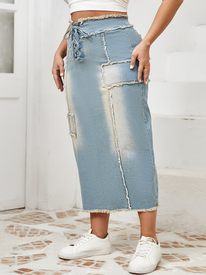 Women's high-waist denim midi skirt with frayed hem and lace-up details in a gradient light blue to dark wash. Raw edge detailing, versatile for spring/summer/fall.