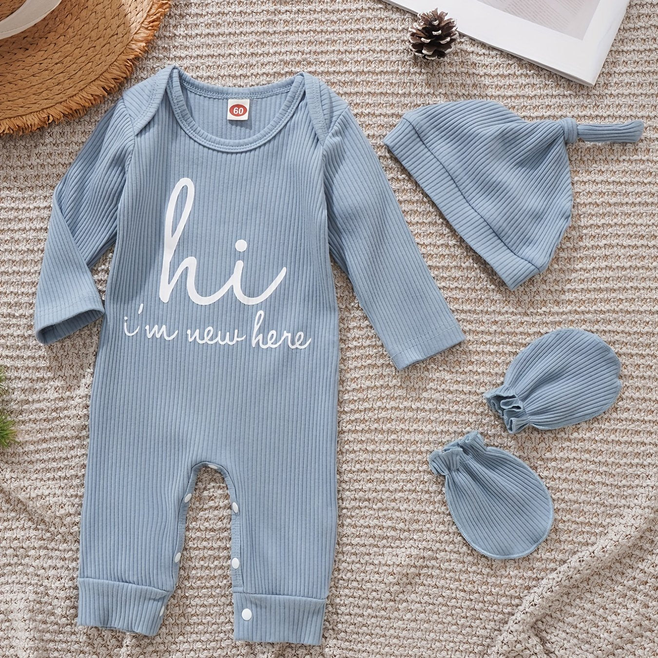 Newborns' "Hi I'm New Here" outfit: long-sleeve romper, hat, and gloves for boys and girls for outdoor wear.