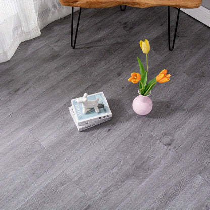 32 peel and paste floor tiles with wood grain design, 45cmx15cm, self-adhesive, waterproof, suitable for bedroom and home decor.