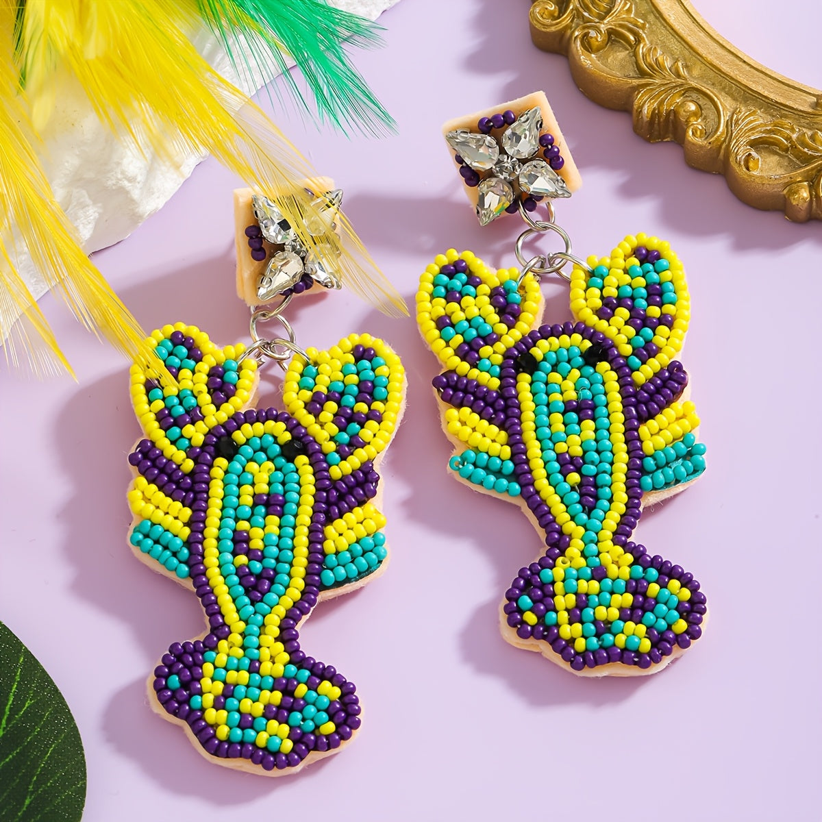 Mermaid-inspired beaded earrings with a Boho twist, adorned with colorful beads and rhinestones. Featuring a lobster claw design and stainless steel posts, these festive Mardi Gras earrings are perfect for daily wear or party occasions year-round.