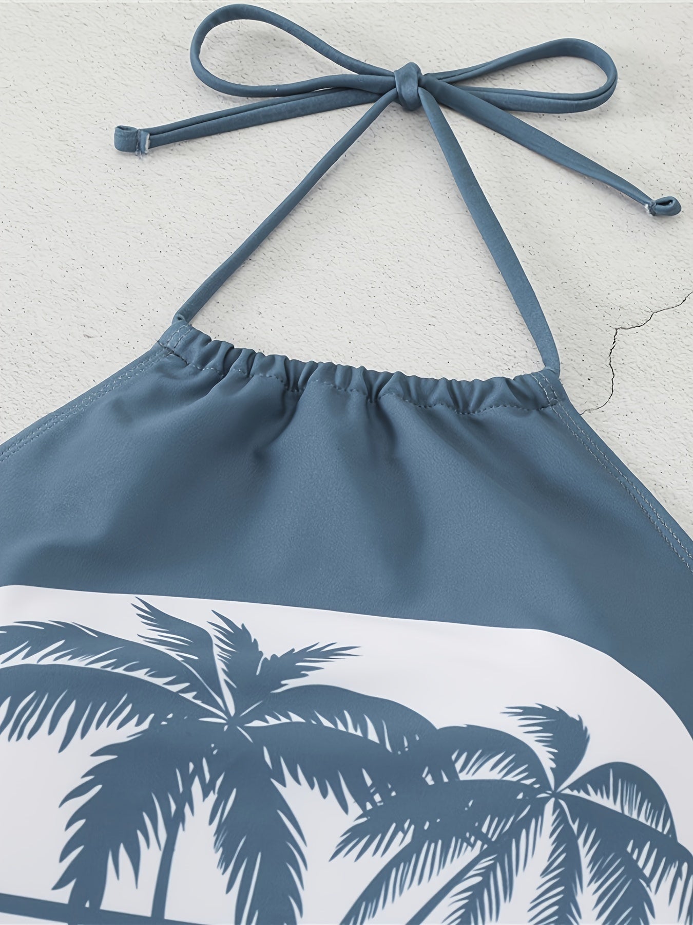 Padded bra swimsuit with palm tree print.