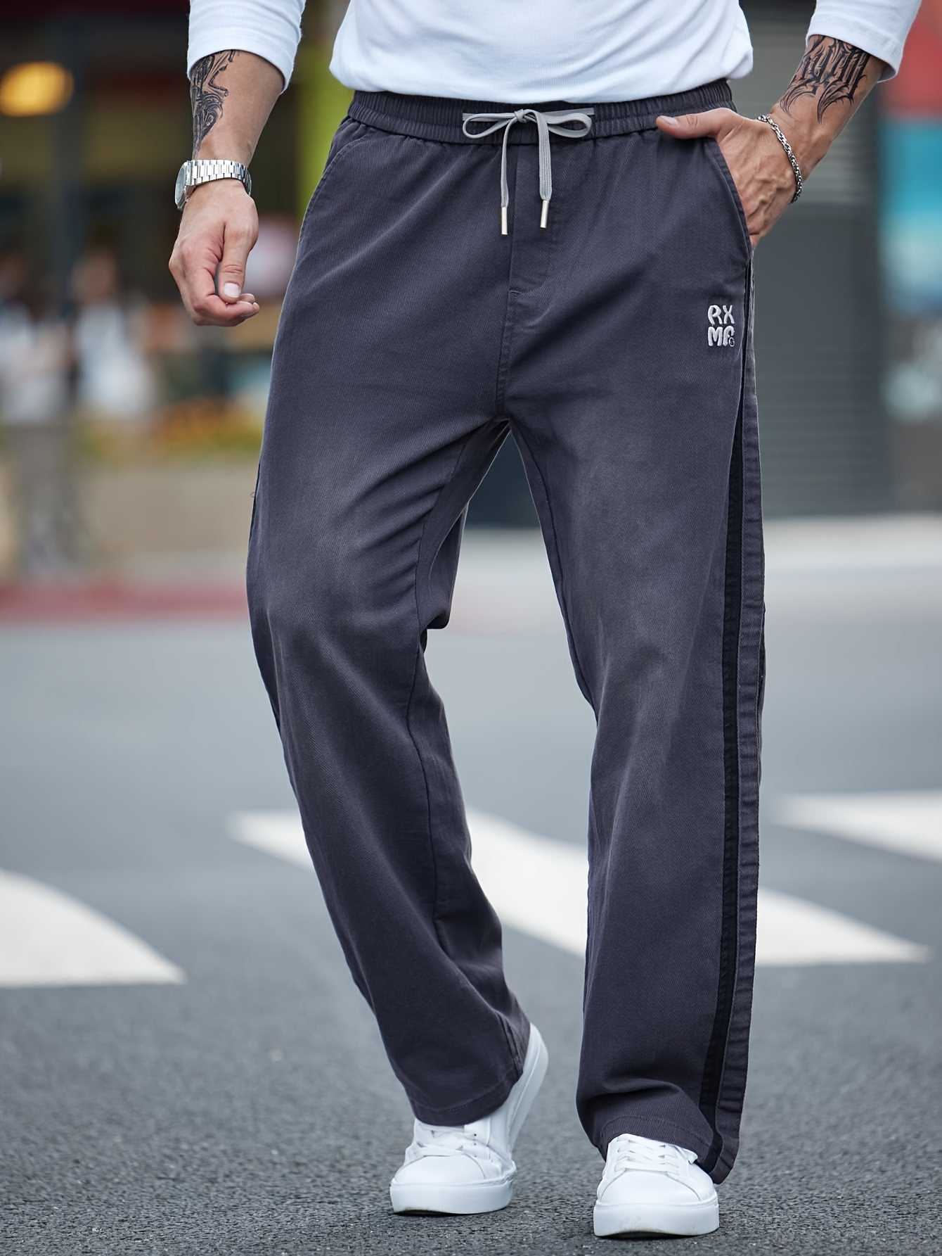 Men's cotton blend label decor straight leg pants with drawstrings for casual sports in spring and fall.