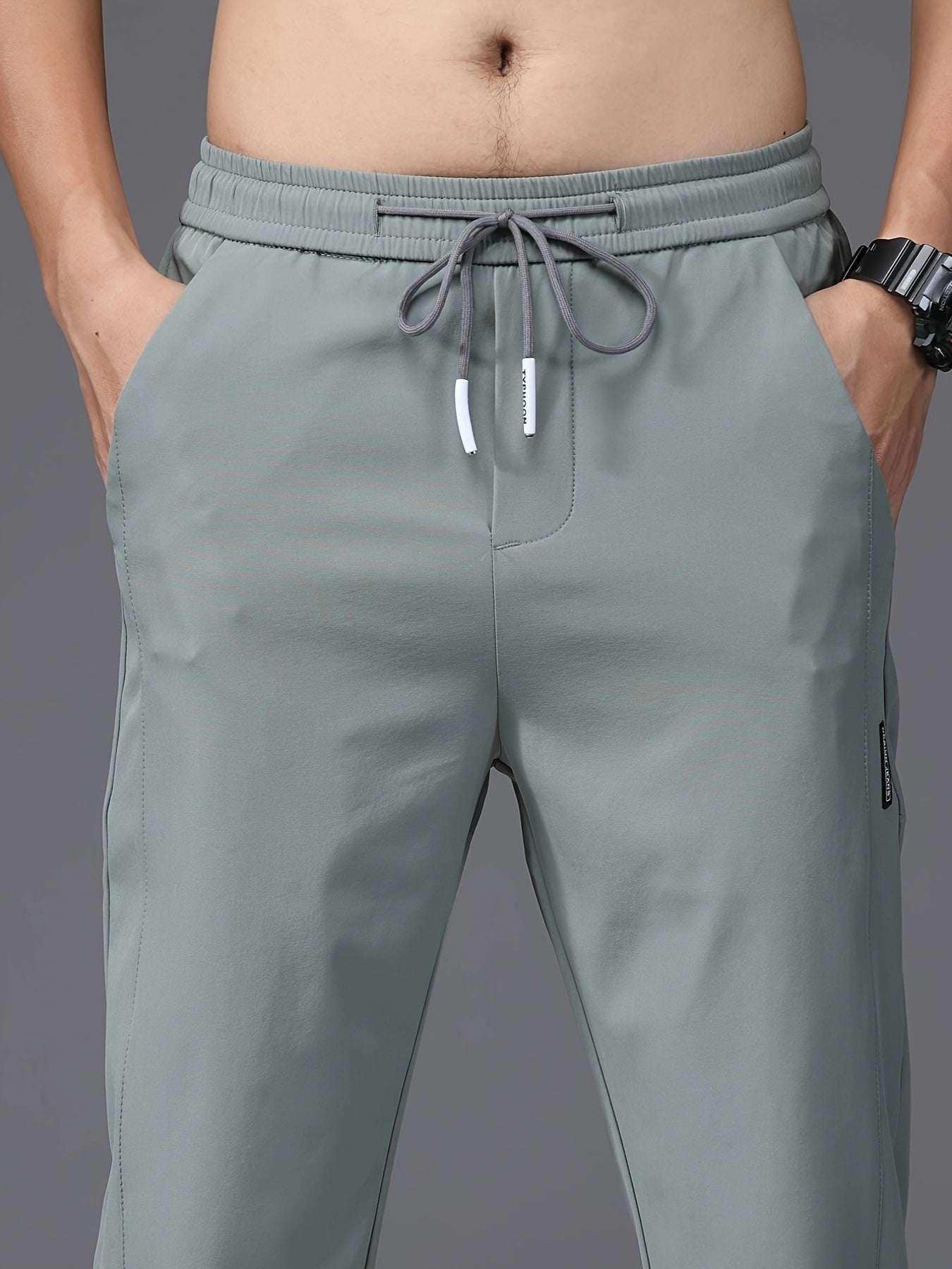 Men's slim fit drawstring sports pants, lightweight quick-dry trousers for summer leisure wear.