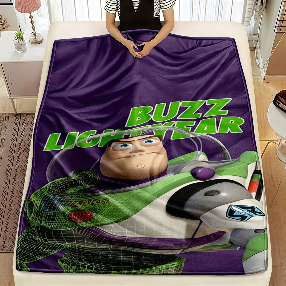 Buzz Lightyear, the adventurous astronaut in green, is enjoying playtime with his green dinosaur friend. His playful demeanor is evident in his exaggerated expressions, reflecting his childlike innocence. Happily seated on a vibrant purple blanket, he