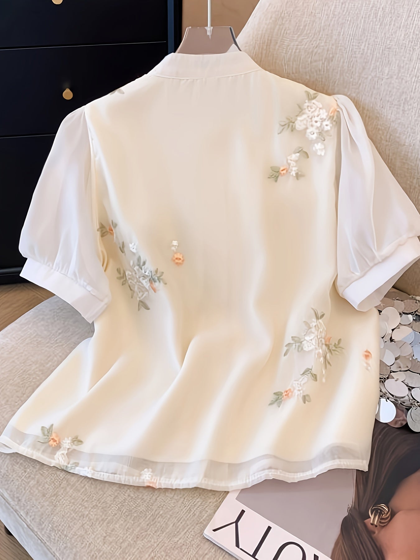 Women's chic floral blouse with green leaves & tassel details, ruffled cuffs, machine washable, perfect for spring/summer, casual chic style, button-up front, polyester fabric.