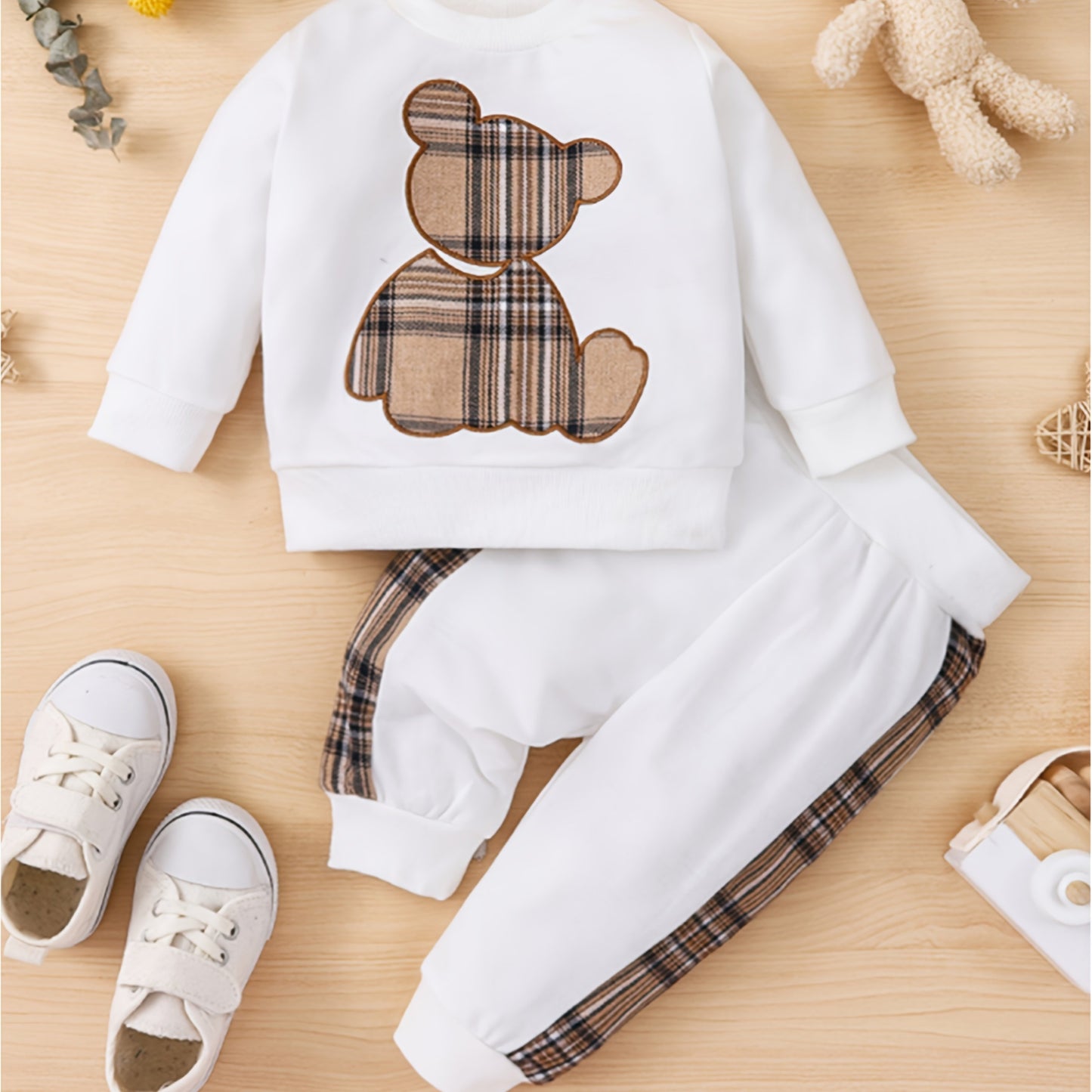 Toddler boy's outdoor fall/winter outfit with long sleeve sweatshirt and casual pants.