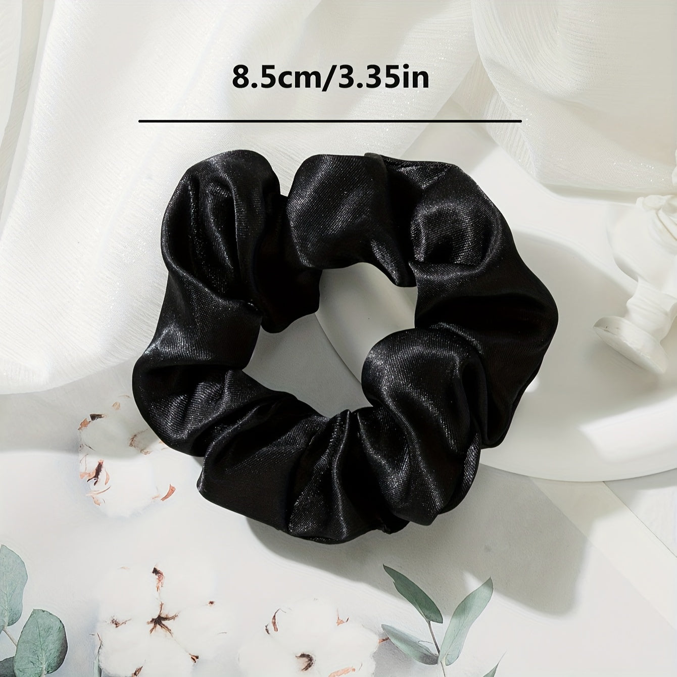 5 elegant and versatile hair scrunchies in classic black, white, and brown suited for all ages.