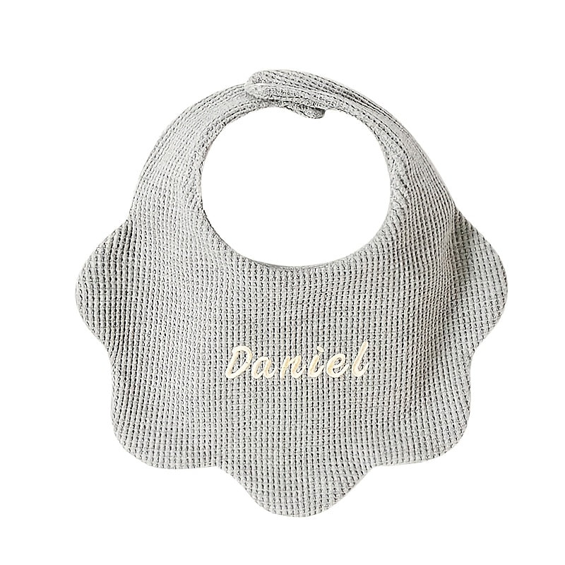 Customize your baby's style with our Personalized Drool Bibs. These bibs feature custom embroidery, an adjustable snap closure, and soft absorbent knit fabric. They make the perfect gift for a baby shower or holiday. Suitable for babies aged 0-3 years