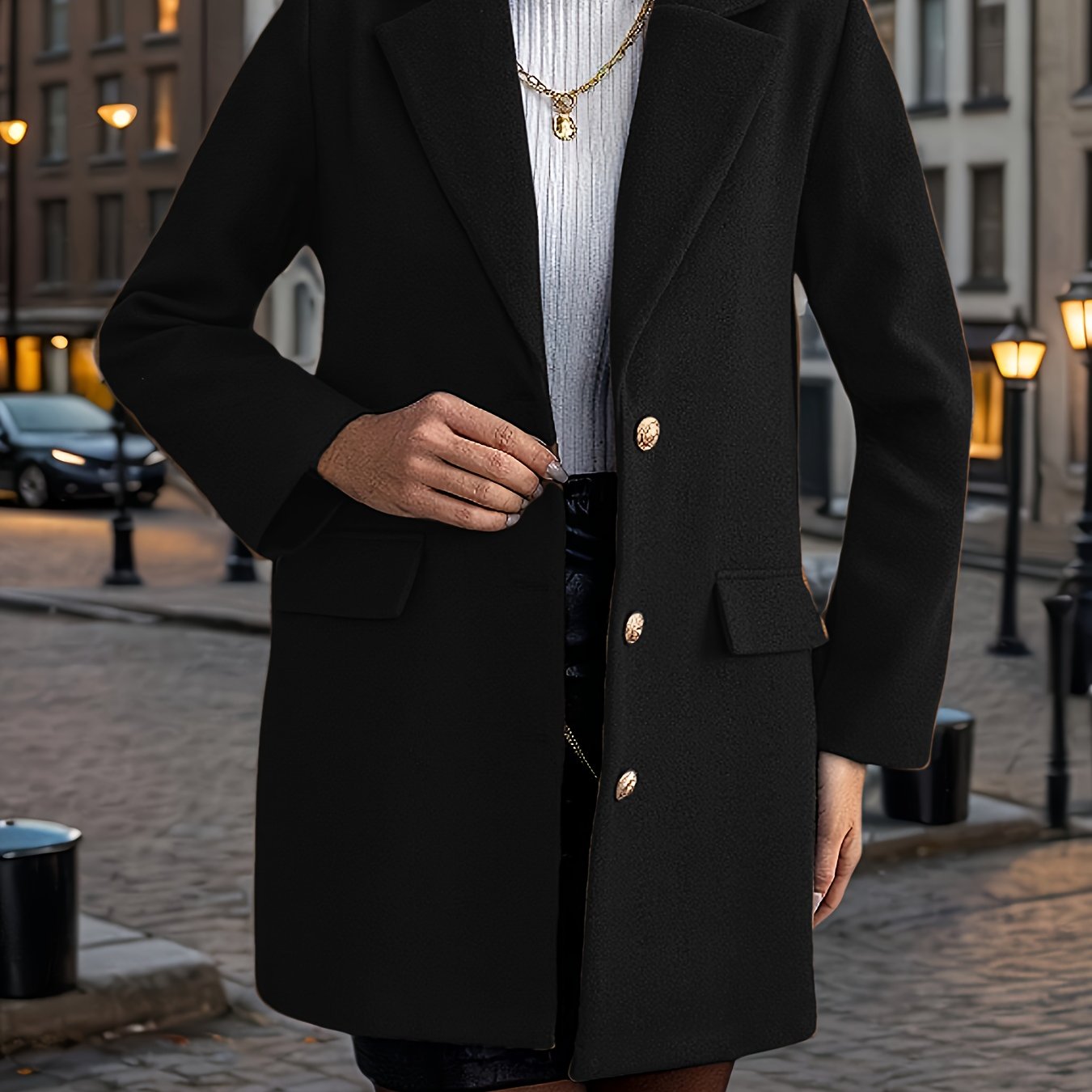 A stylish women's coat with a notched lapel, long sleeves, single-breasted closure, and fake pockets, made of polyester woven fabric for fall/winter outerwear.