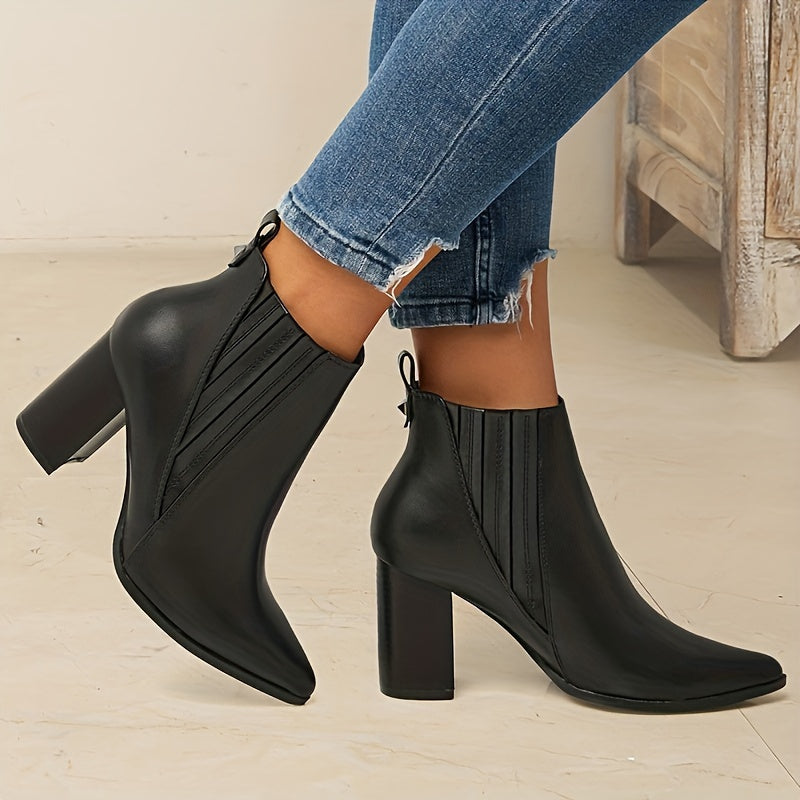 Trendy slip-on ankle boots in solid colors with chunky heels and a pointed toe.