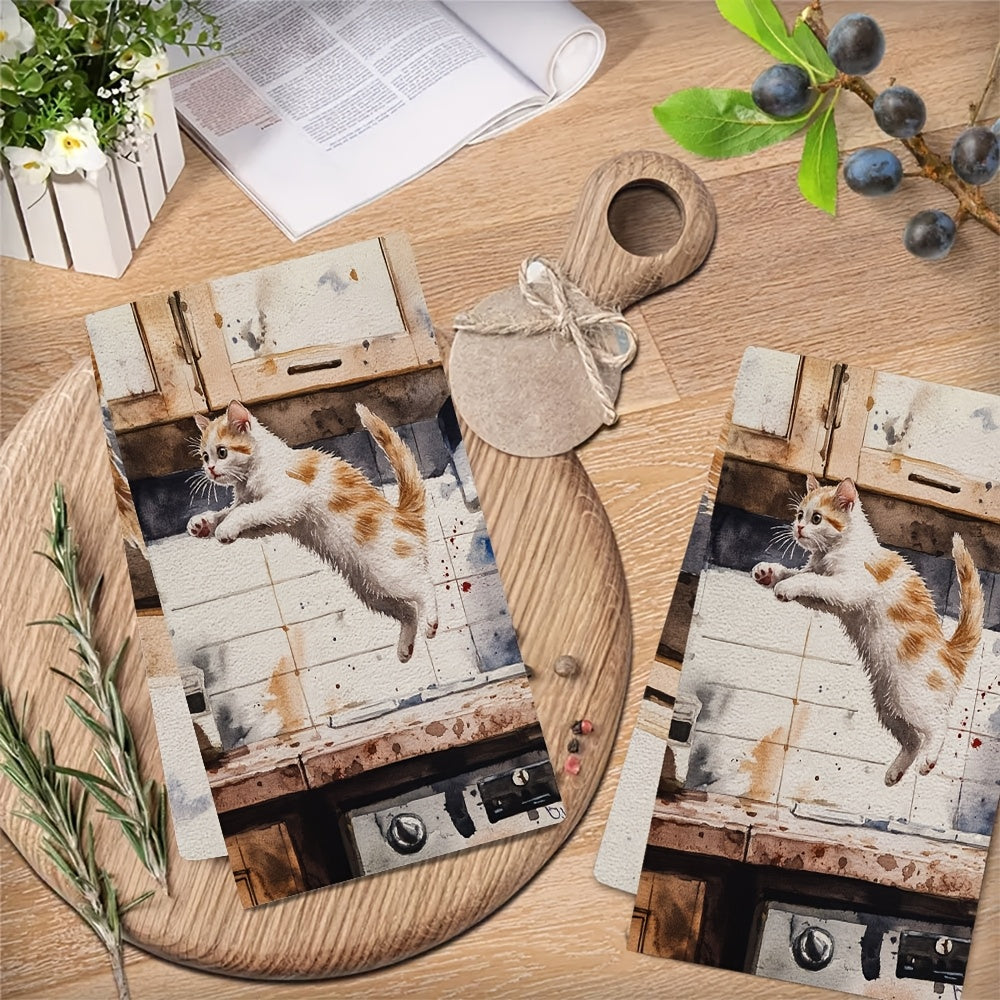 Two pieces of incredibly soft kitchen towels featuring a playful kitten leaping design. These highly absorbent and machine washable dish hand towels are perfect for your contemporary style kitchen. Each towel measures 40.64x60.96 cm and is ideal for