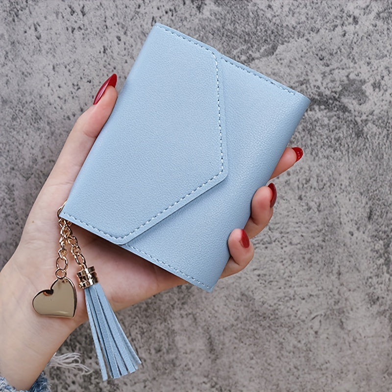 Compact trifold wallet for women with faux clutch coin purse, minimalist credit card holder, stylish tassel charm, and versatile for daily use.