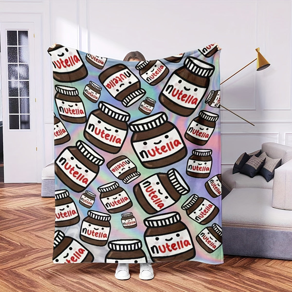 Soft and warm Nutella-themed flannel throw blanket featuring a contemporary design. This all-purpose blanket is perfect for any season and can be used at home, in the office, during fitness activities, while traveling, camping, on the couch, chair, or