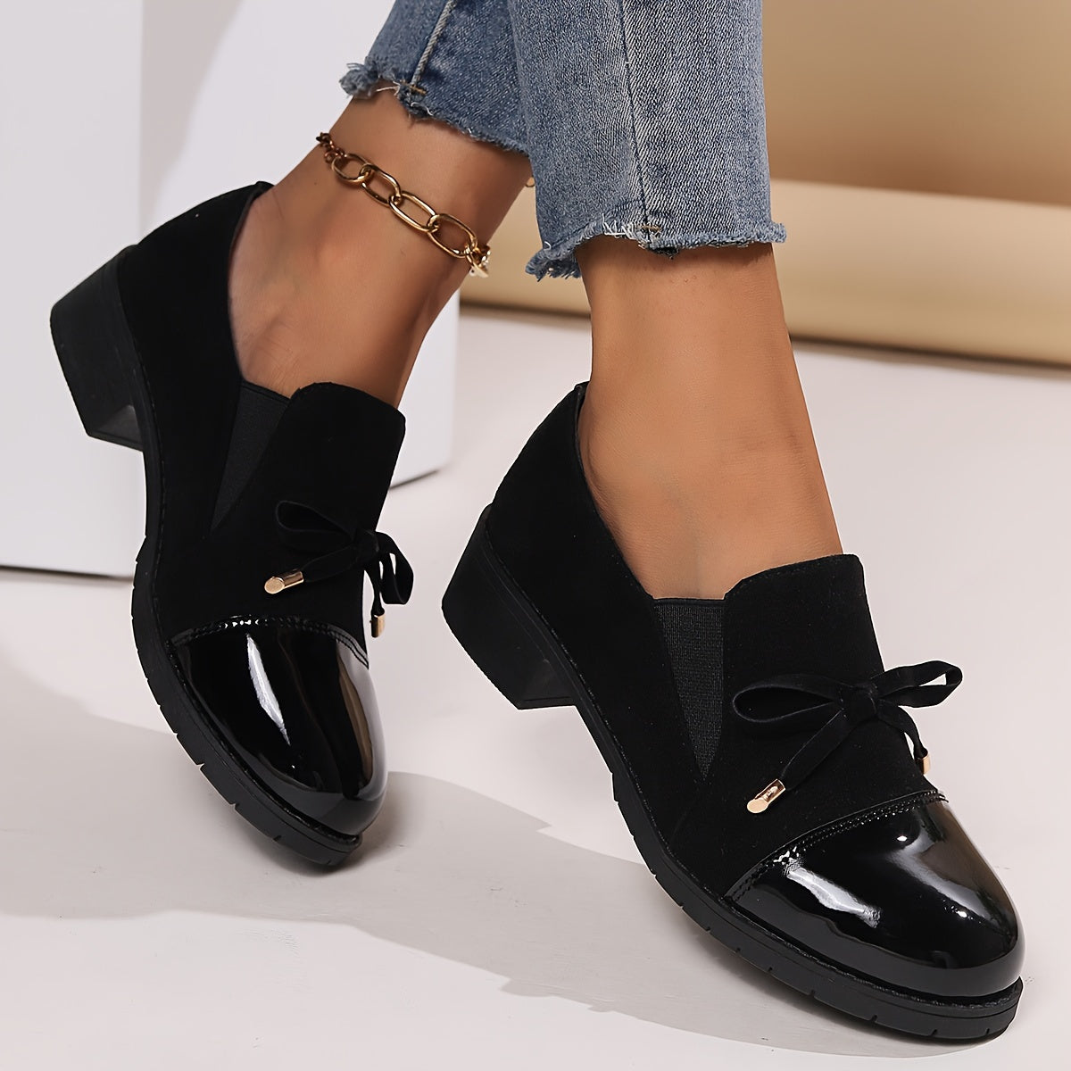 Retro bowknot loafers for women - breathable slip-on casual shoes with chunky heel, black cover upper, all-season comfort. Round toe design and decorative strap detail.