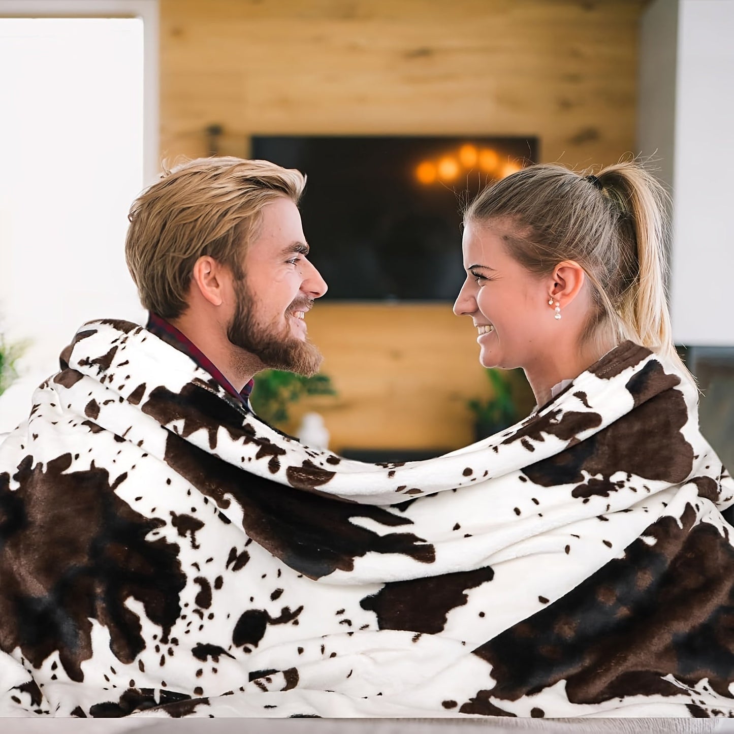 Soft and lightweight, this plush flannel blanket in a cozy cow print is made of 100% polyester for all-season comfort. Perfect for snuggling on the couch or taking on travel adventures, its adorable brown and white design adds a touch of charm to any