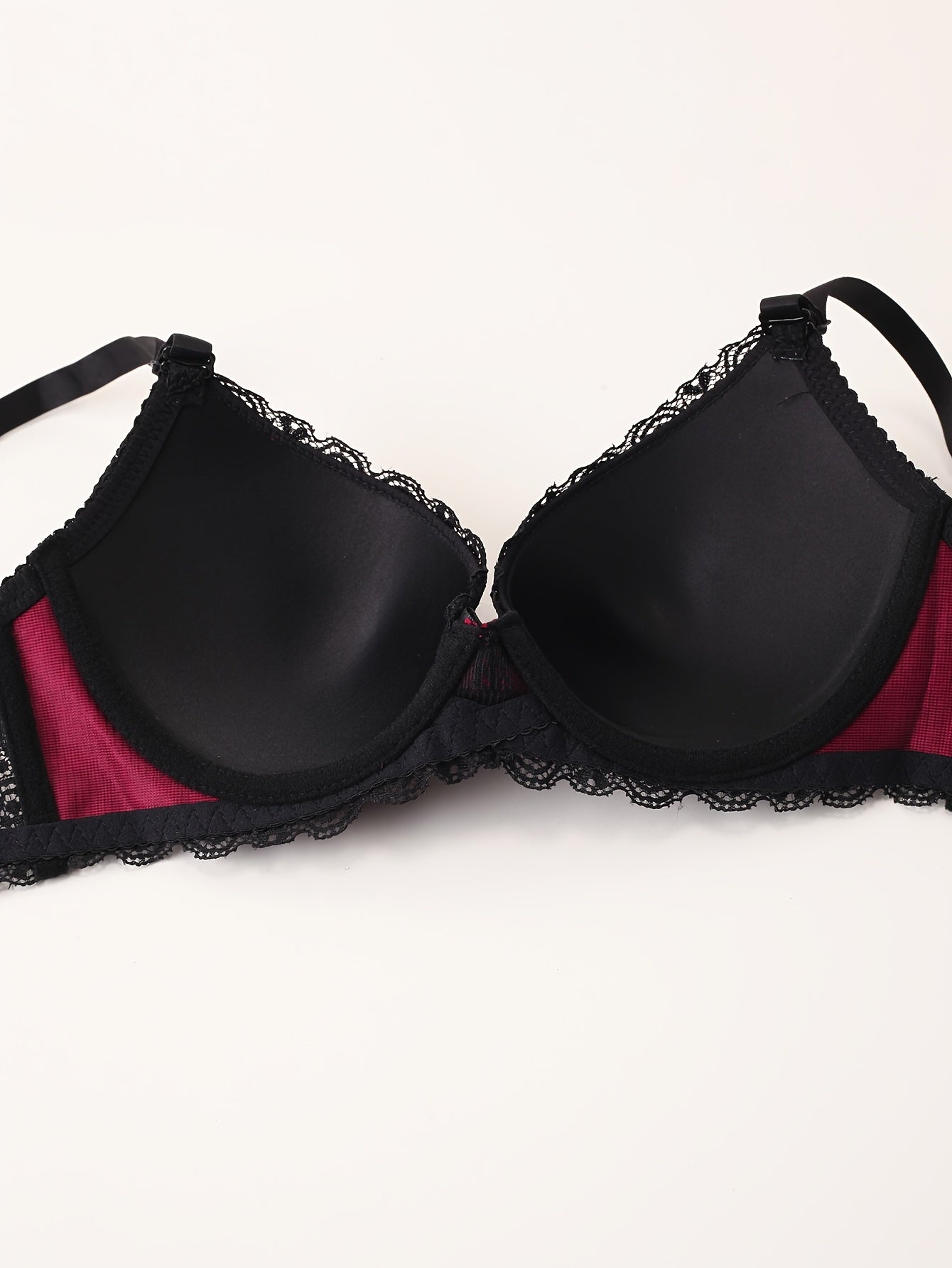 Lace bra and panties vs. push-up bra with bow tie and colorblock thong set for women.