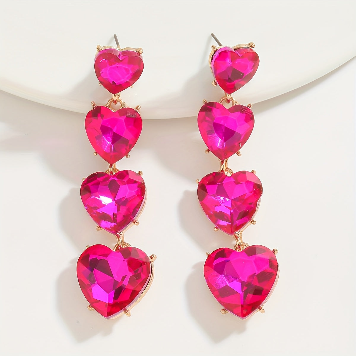 Add a touch of sparkle this Valentine's Day with our Pink Heart & Crystal Winged Drop Earrings. Featuring an elegant bling style, these earrings are made of Zinc Alloy with Stainless Steel Posts, perfect for weddings, parties, and gifts. The Round