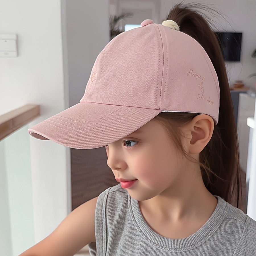 Youngsters' sun protection baseball cap made of 100% polyester with heart pattern, snap closure, and ponytail opening. Suitable for ages 5-10 for daily and casual wear in spring/summer