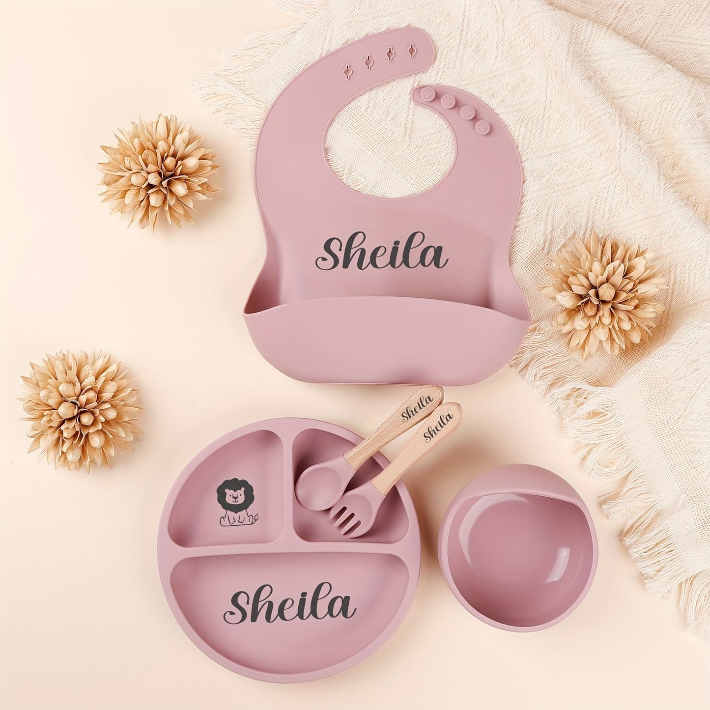 Personalize your child's mealtimes with our Customizable Feeding Set! This set includes a silicone weaning plate with your child's name and a fun cartoon design, along with a spoon, fork, and bowl. It makes the perfect shower gift for new parents.