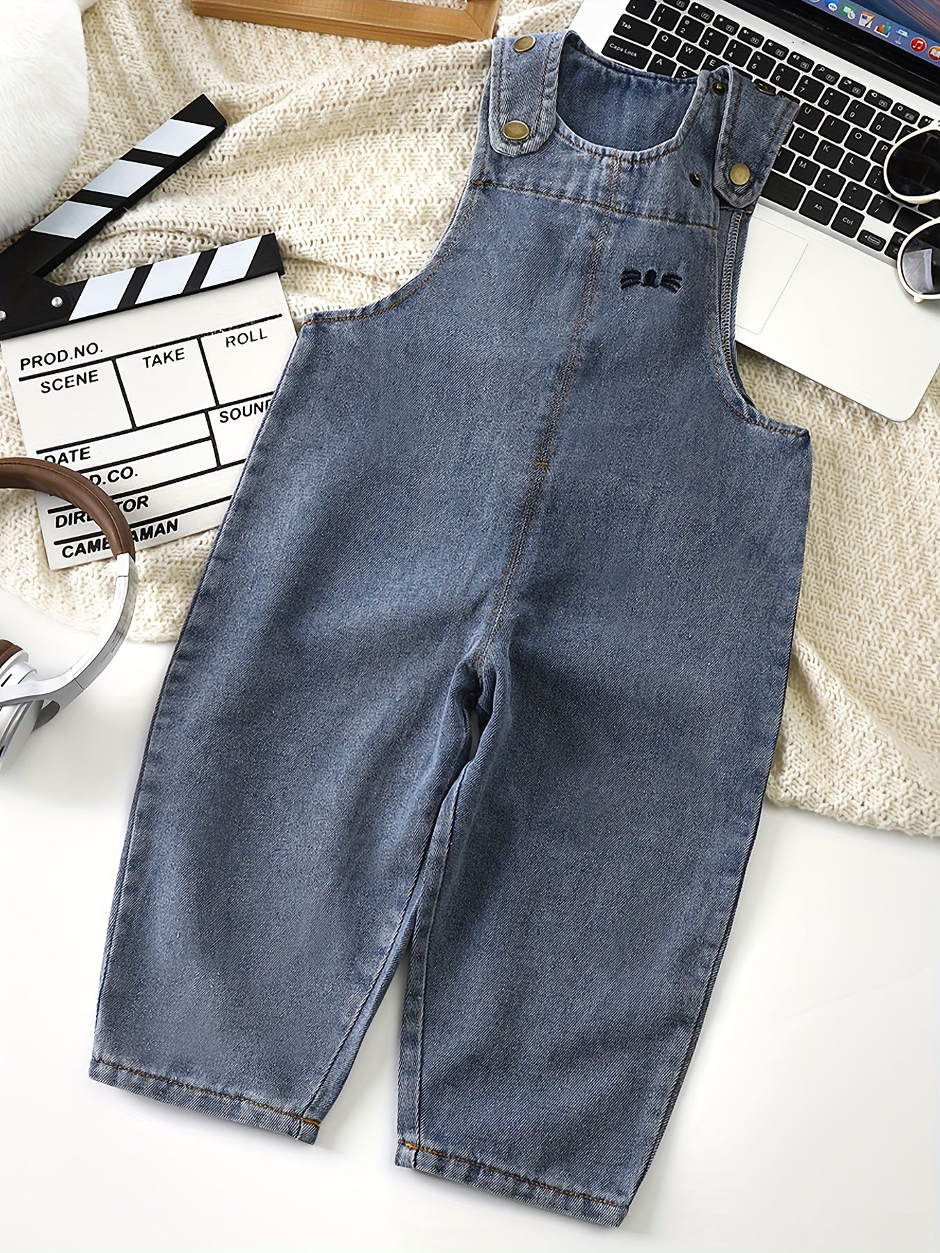 Adorable light blue denim overalls for kids with rabbit ear details. Casual, loose fit for spring & autumn. Machine washable, perfect for outdoor activities.