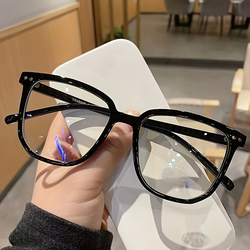 Vision Comfort's Cyberpunk-inspired Square Blue Light Blocking Glasses feature an oval full frame and lightweight PC material for use with computers, TVs, and phones.