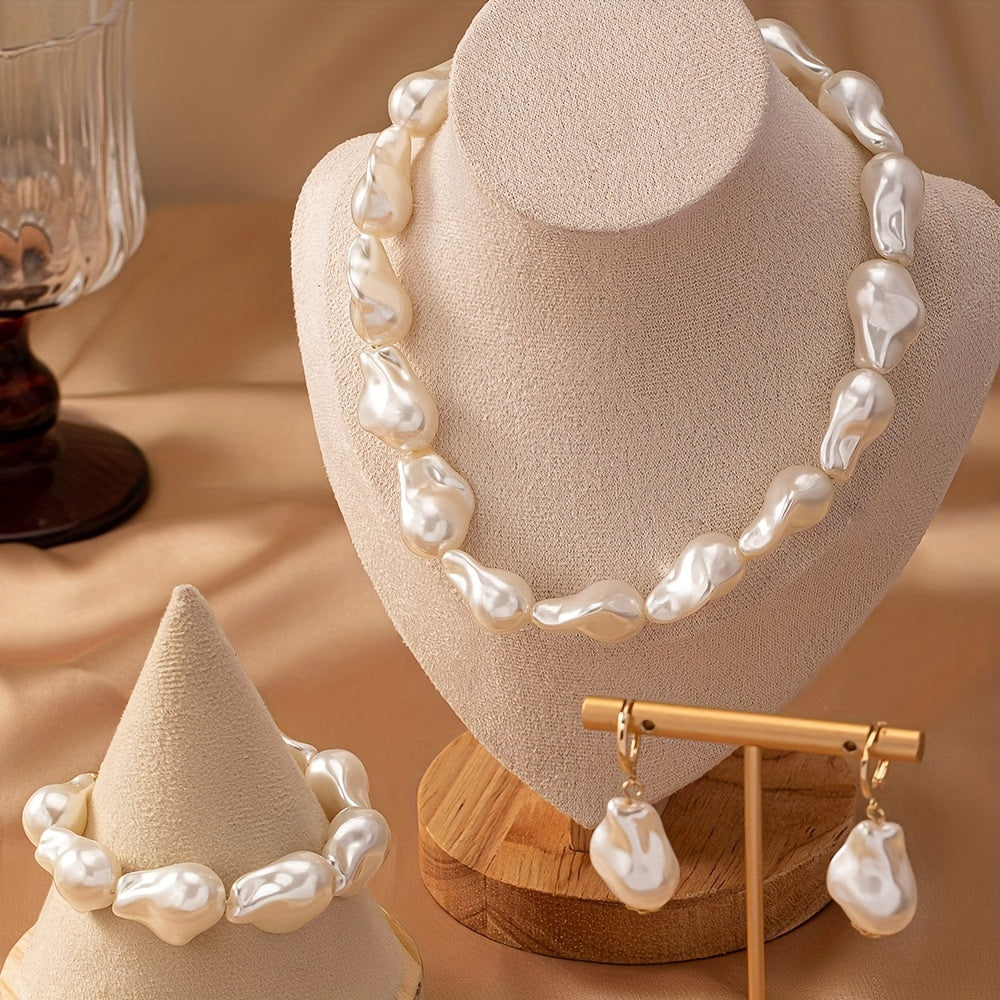 This women's jewelry set features elegant imitation pearls with a simple, un-plated design. The set includes a baroque pearl necklace, bracelet, and earrings, making it versatile for everyday wear. The unique geometric shape design adds a touch of