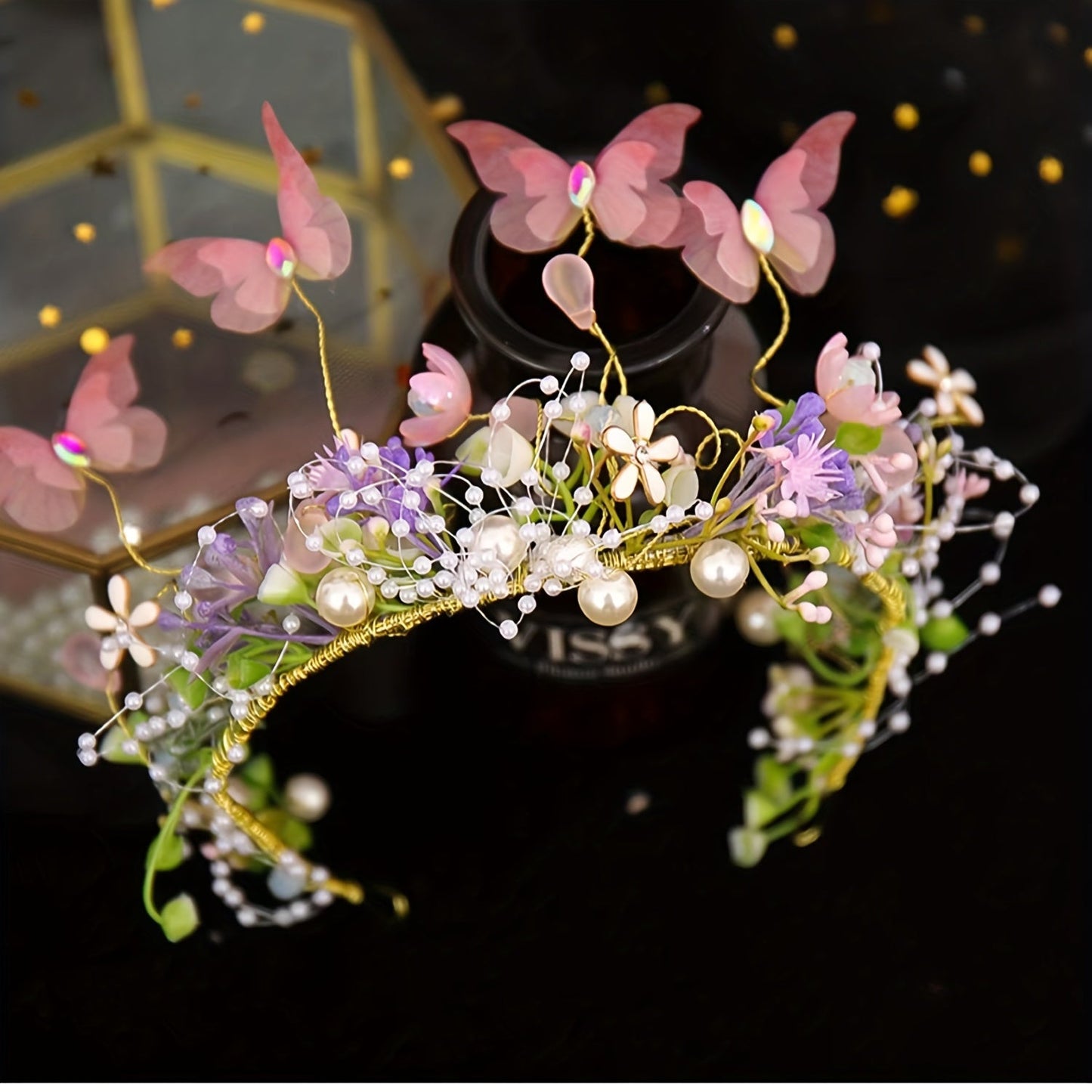 Hair accessories for women featuring a flower headband with butterfly decoration, faux pearl inlays, and a wreath design