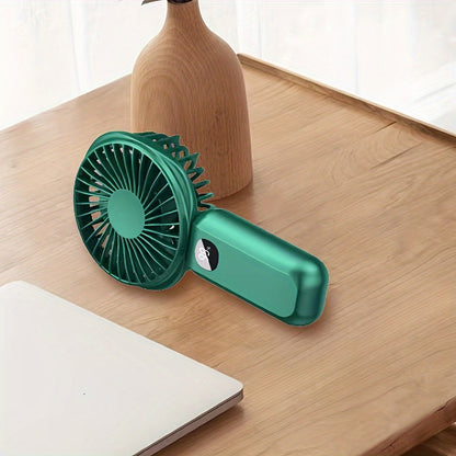 This portable handheld fan features a built-in battery capacity display and can be powered by USB or batteries. It also doubles as a convenient phone holder and is compact and easy to transport. Perfect for both handheld and desktop use, this fan is a