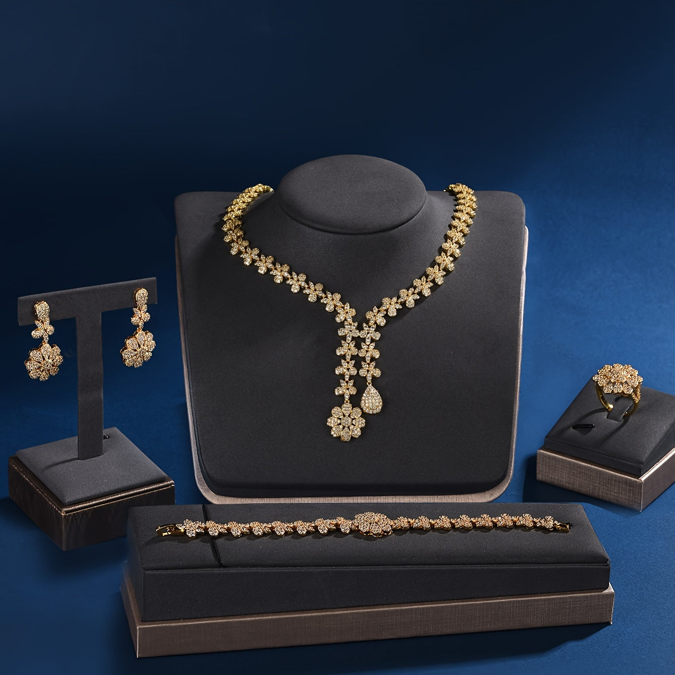 Luxurious 18K Gold Plated Copper Jewelry Set for Women featuring Synthetic Zirconia - Perfect for Parties and Holidays. This 5-Piece Set includes a Necklace, Bracelet, Earrings, and Ring, ideal for Weddings, Parties, and Thanksgiving celebrations.