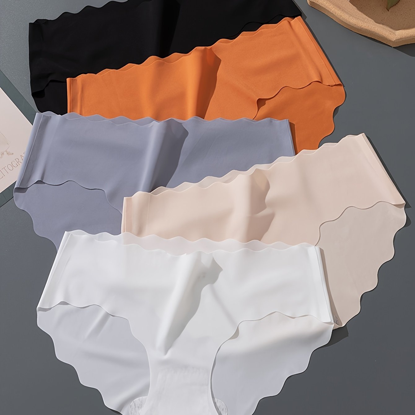 5 seamless low-rise briefs for women in elegant solid colors, offering breathable, invisible lift.