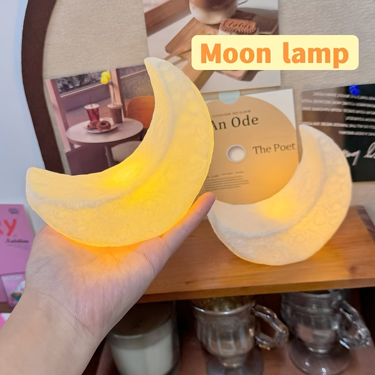 Portable Nordic-style LED moon-shaped lamp perfect for the bedroom, powered by batteries and ideal as a holiday decoration or gift.