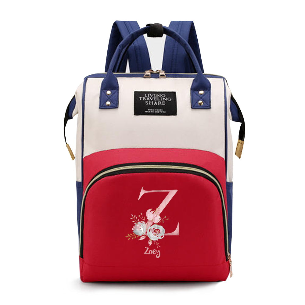 Personalized Mommy Backpack made of durable Oxford cloth with ample storage space for diapers and other essentials. Features customizable initials and name, as well as convenient bottle pockets. Perfect for nursing mothers on-the-go, with options for A-Z