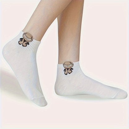 5 pairs of cute cartoon print white socks for women, soft and breathable.