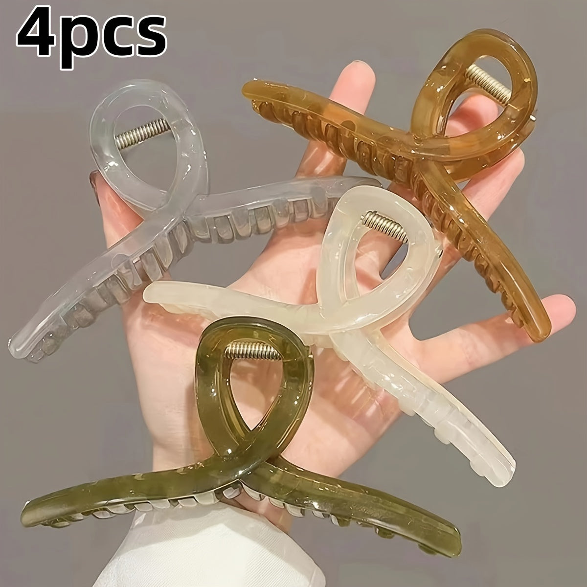 4 transparent grip clips with large shark clip design for back of head hair styling.